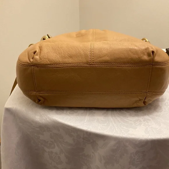 This is a coach leather bag with a shoulder strap and a carry handle - Picture 4 of 6